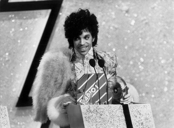 Prince 1973357 Prince by Unknown photographer, (20th century); (add.info.: Prince (Prince Rogers Nelson) at the London TV Awards Ceremony, receiving the Best International Artist Award and Best Film Purple Rain on February 14, 1985). Copyright: xBridgemanxImagesx 1973357