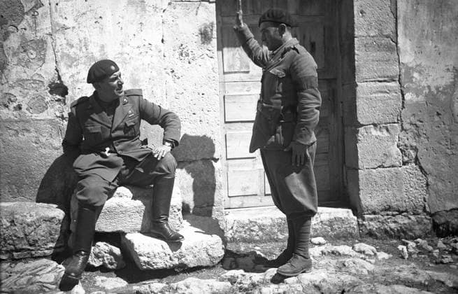 Spanish Civil War 1936-1939: Italian fascist soldiers pass through Jerez de la Frontera, Guadalajara, Almadrones, Navalpotro, Calamocha and Labastida to arrive in Santander. Soldier greets a fellow, Spain 3571304 Spanish Civil War 1936-1939: Italian fascist soldiers pass through Jerez de la Frontera, Guadalajara, Almadrones, Navalpotro, Calamocha and Labastida to arrive in Santander. Soldier greets a fellow, Spain; (add.info.: Spanish Civil War 1936-1939: Italian fascist soldiers pass through Jerez de la Frontera, Guadalajara, Almadrones, Navalpotro, Calamocha and Labastida to arrive in Santander. Soldier greets a fellow, Spain Photographer: Sandri Guglielmo); Alinari Archives, Florence. Copyright: xAlinarixArchives,xFlorencex xBridgemanxImagesx 3571304