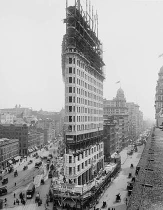 Construction of Flatiron Building, New York City, New York, USA, 1902 (b w photo) 3963993 Construction of Flatiron Building, New York City, New York, USA, 1902 (b w photo) by American Photographer, (20th century); Private Collection; (add.info.: Detroit Publishing Company, Flatiron Building during construction in 1902. The steel frame construction, a rectangular grid of I-beams, ascends above the stone facing. Signs advertise space for rent in 22 stories of what was then called the Fuller Building. ). Copyright: xBridgemanxImagesx 3963993