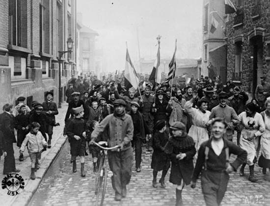 Armistice Day in Paris, 1918 (b w photo) 4072724 Armistice Day in Paris, 1918 (b w photo) by American Photographer, (20th century); Private Collection; (add.info.: Everybody nearly yelled their heads off an Armistice Day in Paris, November 11th, 1918. Here children and grownups, singing the Marseillaise, marching about the streets photographed by United States Army Signal Corp). Copyright: xBridgemanxImagesx 4072724
