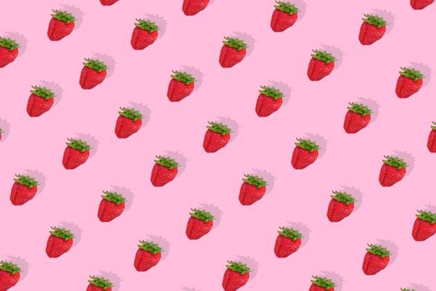 Modern retro color theme pattern of red strawberries against a pink background. Modern retro color theme pattern of red strawberries against a pink background. Copyright: xMilleflorexImagesx MIL150124-44