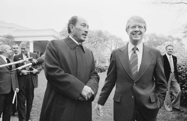 President Jimmy Carter with Egyptian President Anwar Sadat at the White House, 1977 (b w photo) 5962956 President Jimmy Carter with Egyptian President Anwar Sadat at the White House, 1977 (b w photo) by Trikosko, Marion S. (fl.1964); Private Collection; (add.info.: Muhammad Anwar Al Sadat (1918-81) third President of Egypt from 1970 until his assassination on 6 October 1981. Led the 1973 War against Israel, later signing the Egypt-Israel Peace Treaty, brokered by President Carter (1924- ) 39th President of the United States through the 1978 Camp David Accords). Copyright: xBridgemanxImagesx 5962956