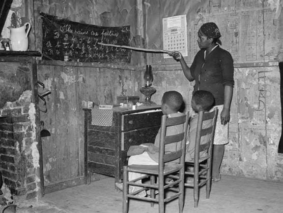 Negro mother teaching children numbers and alphabet in home of sharecropper, Transylvania, Louisiana, 1939 (b w photo) 7176933 Negro mother teaching children numbers and alphabet in home of sharecropper, Transylvania, Louisiana, 1939 (b w photo) by Lee, Russell (1903-86); 1939 cm; Private Collection. Copyright: xBridgemanxImagesx 7176933