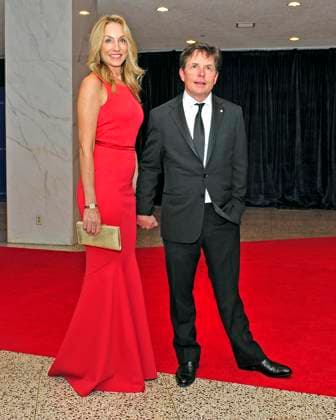 Michael J. Fox and his wife, Tracy Pollan, arrive for the 2013 White House Correspondents Association Annual Dinner at the Washington Hilton Hotel on Saturday, April 27, 2013..Credit: Ron Sachs CNP.(RESTRICTION: NO New York or New Jersey Newspapers or newspapers within a 75 mile radius of New York City) EDITORIAL USE ONLY Copyright: xx x cnpphotos044451