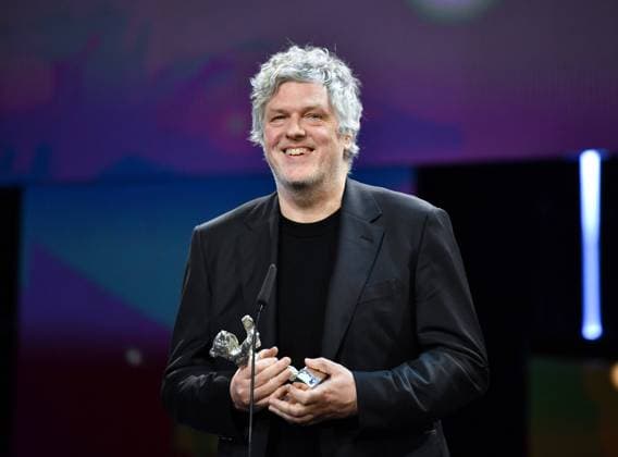 (240225) -- BERLIN, Feb. 25, 2024 -- German director Matthias Glasner speaks after receiving the Silver Bear for Best Screenplay during the 74th Berlin International Film Festival in Berlin, Germany, Feb. 24, 2024. ) GERMANY-BERLIN-INTERNATIONAL FILM FESTIVAL RenxPengfei 