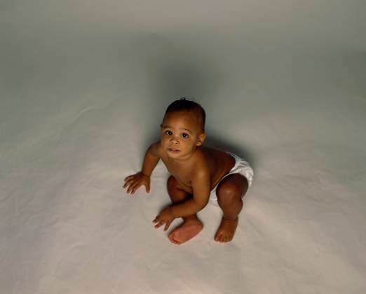 High angle view of a baby sitting and looking up  Copyright: xx 1099R-5057