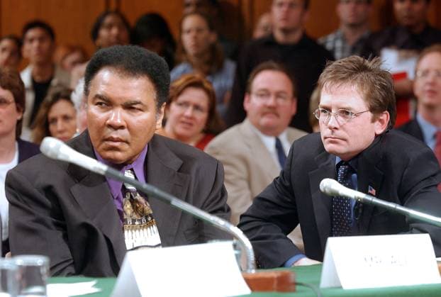 Mohammad Ali, left and Michael J. Fox, right, testify during the United States Senate Appropriations Subcommittee on Labor and HHS hearing on Parkinson s Disease in Washington, DC on May 22, 2002. Both the Champ and Mr. Fox advocated for increased funding to the National Institutes of Health (NIH) for Parkinson s research. Credit: Ron Sachs CNP EDITORIAL USE ONLY Copyright: xx x cnpphotos062831