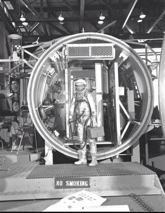 Glenn Altitude Chamber Test Astronaut John H. Glenn Jr., suited with hose to suit ventilation unit attached, during altitude chamber test in 1961. He is standing in the entrance to the test chamber with his helmet visor down..Credit: NASA via CNP Houston Texas United States of America EDITORIAL USE ONLY Copyright: xx M61-0150 NASAx cnpphotos064352