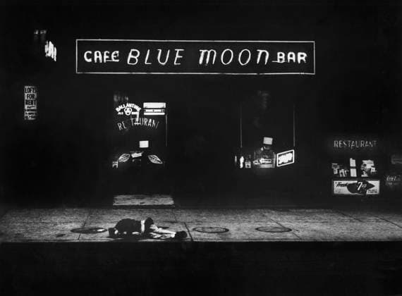 Man lying on sidewalk in front of bar with sign above reading Cafe Blue Moon Bar , New York City, New York, USA, Angelo Rizzuto, Anthony Angel Collection, December 1957 Man lying on sidewalk in front of bar with sign above reading Cafe Blue Moon Bar , New York City, New York, USA, Angelo Rizzuto, Anthony Angel Collection, December 1957. Copyright: 1010_45_ghi-circa12354