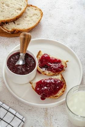 raspberry jam on bread on a plate R_KUAL240223-1355310-01