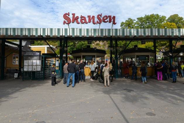 Entrance of Skansen Museum in Sweden with people waiting Portrait of Skansen Museum with people waiting in Stockholm, Sweden Copyright: xZoonar.com TonixRantalax 16368112