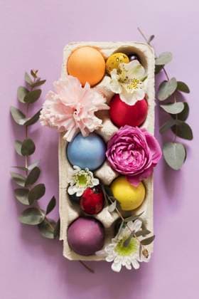 Colorful Easter eggs decorated with flowers on pink background, ONAF00716