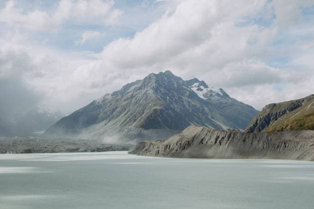 Creative Highlights World Tasman Glacier viewpoint with Mount Cook and cloudy sky Aoraki Mount Cook, Canterbury, New Zealand CR_UTNS240301C-1319323-01