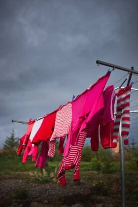 Pink clothes on washing line Iceland, Borgarbyggð, Reykholt R_EZDKCL240228I-1345903-01 ,property released
