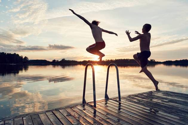 Boys jumping into lake , model released Copyright: xJohnerxImagesx , johner2290950.jpg 