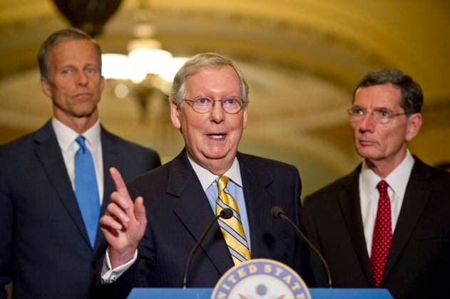 United States Senate Majority Leader Mitch McConnell (Republican of Kentucky) speaks to reporters following the Republican Party luncheon in the United States Capitol in Washington, DC on Tuesday, June 27, 2017. In his remarks, Leader McConnell announced there would be no vote on the GOP healthcare plan this week. From left to right: US Senator John Barrasso (Republican of Wyoming), Leader McConnell, and US Senator John Thune (Republican of South Dakota). Credit: Ron Sachs CNP EDITORIAL USE ONLY Copyright: xx x cnpphotos120900
