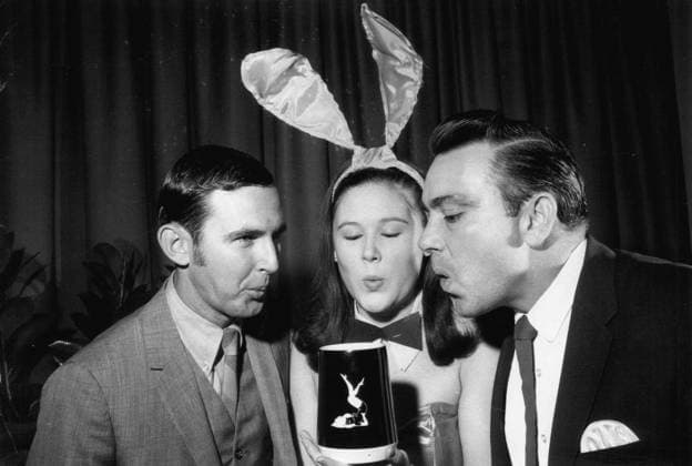 Jan 12, 1969 - St. Petersburg, Florida, U.S. - That s imaginary beer foam on a real playboy club mug. Getting the attention of (from left) clyde McCrary, candy Benson and Jim Smithson at the AIB party. St. Petersburg U.S. - ZUMAs70_ 19690112_nws_s70_106 Copyright: xBobxHannah TampaxBayxTimesx
