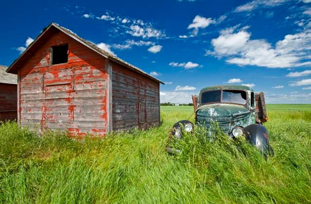 old farm truck beside grain bin, near Hazenmore, Saskatchewan, Canada  Copyright: x xAllxCanadaxPhotosx 1990-61217