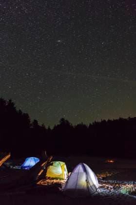 Three tents under the night sky on Vargas Island off the west coast of Vancouver Island British Columbia, Canada.  Copyright: x AllxCanadaxPhotosx 1990-74684
