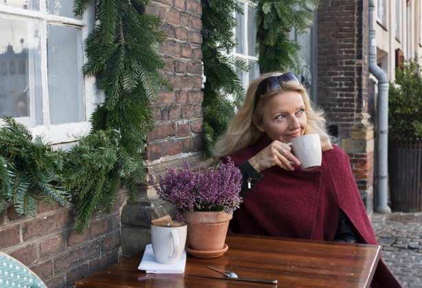 Woman sitting at table in outdoor cafe , model released Copyright: xJohnerxImagesx , johner2408936.jpg 