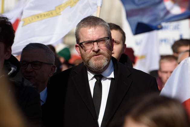 Poland For Peace demonstration in Warsaw. Polish far-right politician and member of the parliament Grzegorz Braun is pictured during a march calling for peace and against sending Polish troops to Ukraine in Warsaw, Poland, on March 9, 2024. A few hundred people took to the streets after French president Emanuel Macron said that NATO troops deployment in Ukraine should not be ruled out. The crowd, lead by the far-right politicians Grzegorz Braun from the Konfederacja (Confederation) party shouted slogans as hands off from our children , Tusk, Kaczynski on the Ukrainian front and This is not our war . Warsaw Poland Copyright: xAleksanderxKalkax