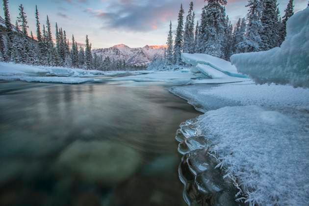 Ice forms on the Wheaton River as it flows towards the Gray Ridge in the distance.  Copyright: x xAllxCanadaxPhotosx 1990-11065321