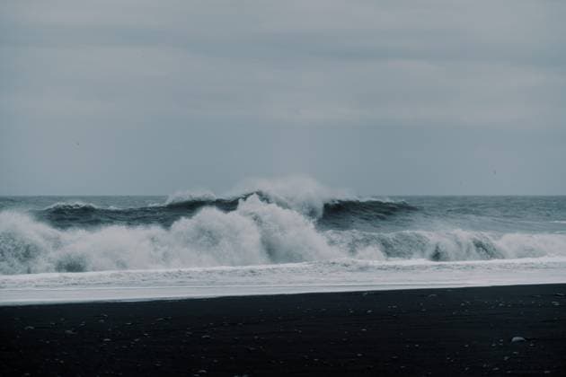 Creative Highlights World Waves crash against contrast black sand rock beach Icelandic nature Vik, Mýrdalshreppur, Iceland R_UTNS240312-1367063-01