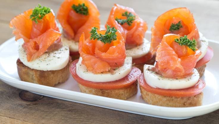 canapes with red fish canapes with salmon and cheese on wooden table Copyright: xZoonar.com RuslanxNassyrovx 8944727