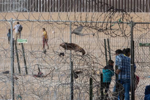 March 13, 2024, Auburn Hills, Michigan, USA: Hundreds of migrants, mainly from Venezuela, are seen crossing the border in Ciudad JuoÂ¡rez, Chihuahua, Mexico. They use a rope to traverse the deep Rio Grande, aiming to avoid detection by the Texas National Guard and later surrender to the Border Patrol. Their goal is to initiate an asylum request process in hopes of starting a new life Auburn Hills USA - ZUMAp241 20240313_zip_p241_023 Copyright: xDavidxPeinadox