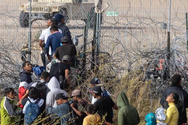 March 13, 2024, Auburn Hills, Michigan, USA: Hundreds of migrants, mainly from Venezuela, are seen crossing the border in Ciudad JuoÂ¡rez, Chihuahua, Mexico. They use a rope to traverse the deep Rio Grande, aiming to avoid detection by the Texas National Guard and later surrender to the Border Patrol. Their goal is to initiate an asylum request process in hopes of starting a new life Auburn Hills USA - ZUMAp241 20240313_zip_p241_024 Copyright: xDavidxPeinadox