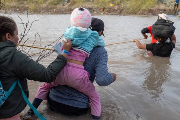 March 13, 2024, Auburn Hills, Michigan, USA: Hundreds of migrants, mainly from Venezuela, are seen crossing the border in Ciudad JuoÂ¡rez, Chihuahua, Mexico. They use a rope to traverse the deep Rio Grande, aiming to avoid detection by the Texas National Guard and later surrender to the Border Patrol. Their goal is to initiate an asylum request process in hopes of starting a new life Auburn Hills USA - ZUMAp241 20240313_zip_p241_035 Copyright: xDavidxPeinadox