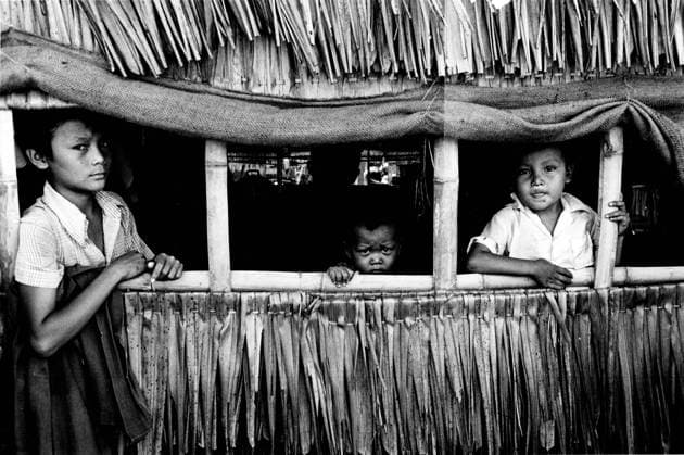 January 4, 1947. Location: unknown. Three young boys gaze out of a grass house. London United Kingdom - ZUMAk09_ 19470104_jtc_k09_419 Copyright: xKeystonexPressxAgencyx