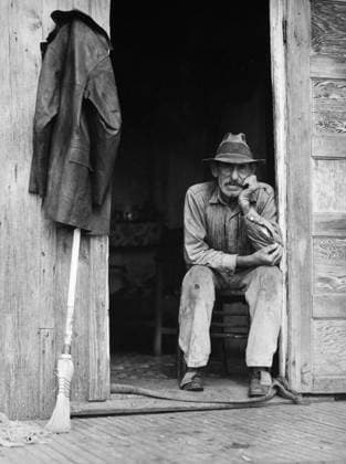 MUSKRAT TRAPPER, 1941. A Spanish muskrat trapper in the doorway of his marsh camp on Delacroix Island, St. Bernard Parish, Louisiana. Photographed by Marion Post Wolcott, January 1941.  Copyright: xGRANGERx xGRANGERx 0004758