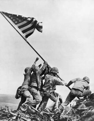 WWII: IWO JIMA, 1945. United States Marines raising the flag over Mount Suribachi, Iwo Jima. Photograph, 23 February 1945.  Copyright: xGRANGERx xGRANGERx 0016445