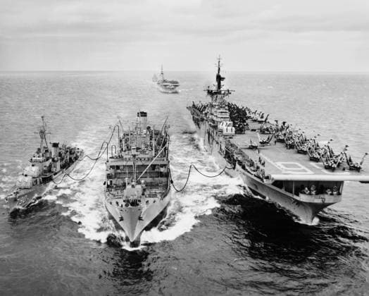 KOREAN WAR: SHIP REFUELING. The destroyer USS Shelton and the aircraft carrier USS Antietam refueling from the tanker USS Tolovana in Korean waters. The aircraft carrier USS Essex, in the the background, awaits her turn. Photograph, 1953.  Copyright: xGRANGERx xGRANGERx 0035250