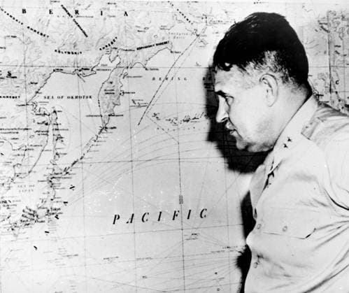 LESLIE RICHARD GROVES (1896-1970). American soldier. General Groves inspecting a map of Japan shortly before the dropping of the first atomic bomb at Hiroshima, Japan. August 1945.  Copyright: xGRANGERx xGRANGERx 0042164