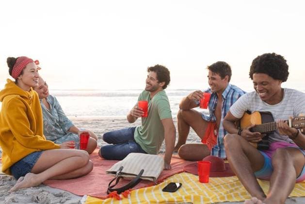 Diverse friends enjoy a beach gathering and having a party Diverse friends enjoy a beach gathering and having a party. Laughter and music fill the air as they share a relaxed outdoor moment., model released, , property released, Cape Town, South Africa, 2024-01-23T22:00:00.000Z, 5113280.jpg, people,diverse friends,beach gathering,party,laughter,music,relaxed,outdoor,moment,fun,friendship,beach,gathering,celebration,diverse group,friends,enjoying,partying,socializing,diverse,relaxation Young Adult,Man,Male,Black,Multiracial,Woman,Female,White