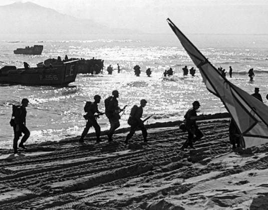 Vietnam: First US Marines wading ashore near Da Nang Air Base, South Vietnam, 1965. The Second Indochina War, known in America as the Vietnam War, was a Cold War era military conflict that occurred in Vietnam, Laos, and Cambodia from 1 November 1955 to the fall of Saigon on 30 April 1975. This war followed the First Indochina War and was fought between North Vietnam, supported by its communist allies, and the government of South Vietnam, supported by the U.S. and other anti-communist nations. The U.S. government viewed involvement in the war as a way to prevent a communist takeover of South Vietnam and part of their wider strategy of containment.<br ><br > The North Vietnamese government viewed the war as a colonial war, fought initially a Copyright: xxPicturesxFromxHistoryx
