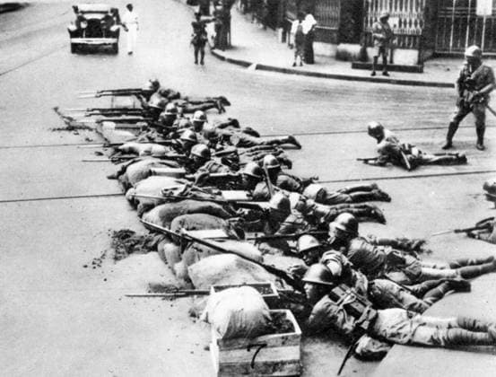 CHINA: JAPANESE INVASION. Japanese marines fighting in the streets of Shanghai behind a sandbag barricade, September 1937.  Copyright: xGRANGERx xGRANGERx 0065089