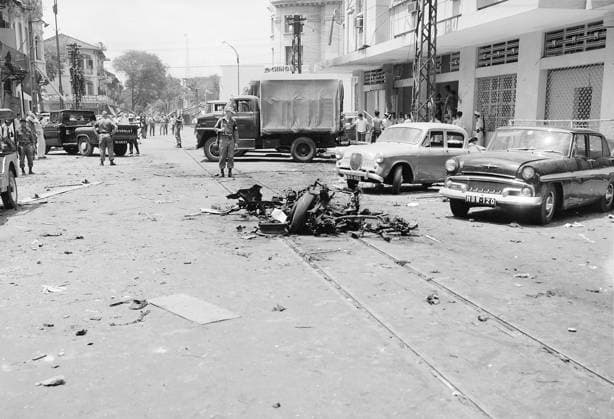 Vietnam: Aftermath of a street bombing attributed to the NLF (Viet Cong) in Saigon, c. 1965. The Second Indochina War, known in America as the Vietnam War, was a Cold War era military conflict that occurred in Vietnam, Laos, and Cambodia from 1 November 1955 to the fall of Saigon on 30 April 1975. This war followed the First Indochina War and was fought between North Vietnam, supported by its communist allies, and the government of South Vietnam, supported by the U.S. and other anti-communist nations. The U.S. government viewed involvement in the war as a way to prevent a communist takeover of South Vietnam and part of their wider strategy of containment.<br ><br > The North Vietnamese government viewed the war as a colonial war, fought in Copyright: xxPicturesxFromxHistoryx