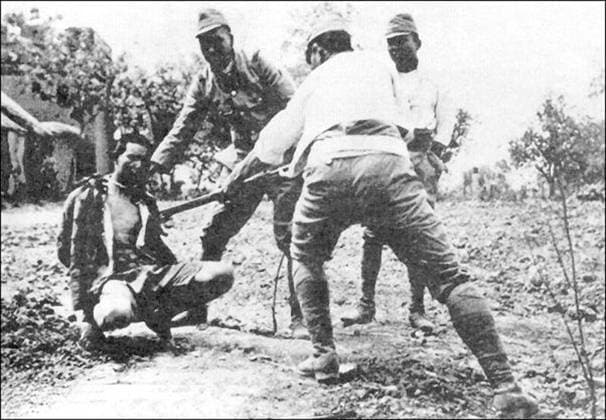 China: Rape of Nanking - Japanese soldiers bayoneting bound Chinese victim. The Nanking Massacre or Nanjing Massacre, also known as the Rape of Nanking, is a mass murder and war rape that occurred during the six-week period following the Japanese capture of the city of Nanjing (Nanking), the former capital of the Republic of China, on December 13, 1937 during the Second Sino-Japanese War. During this period, hundreds of thousands of Chinese civilians and disarmed soldiers were murdered and 20,000 80,000 women were raped by soldiers of the Imperial Japanese Army. Copyright: xxPicturesxFromxHistoryx