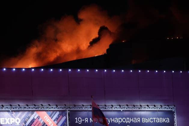 March 22, 2024. Russia, Moscow Region, Krasnogorsk. Smoke rises over the Crocus City Hall in the town of Krasnogorsk where unidentified persons opened fire. Evacuation is underway. DmitryxGolubovich