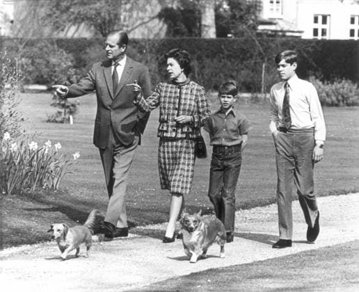 QUEEN ELIZABETH II, 1973. The Queen and Prince Philip tour the gardens of Windsor Castle with two of their children, Prince Andrew, far right, and Prince Edward. Photographed by Lynn Ball, May 1973.  Copyright: xGRANGERx xGRANGERx 0065983