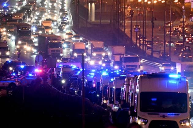 Russia Terrorist Attack 8647866 22.03.2024 Ambulances are parked on the side of a road near the Crocus City Hall concert venue following a shooting incident, outside Moscow, Russia. The Russian Federal Security Service (FSB) said that there are people dead and injured as a result of the terrorist attack in the concert hall in Moscow region. A massive fire has also broken out at the venue. Alexey Maishev Sputnik Moscow region Russia  Copyright: xAlexeyxMaishevx