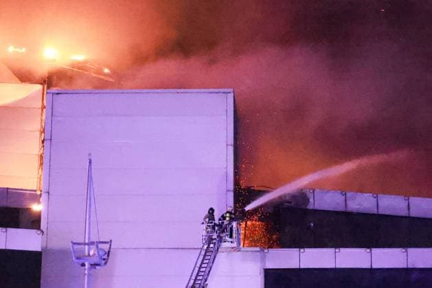 RUSSIA, MOSCOW REGION - MARCH 22, 2024: Firefighters battle a fire at the Crocus City Hall in the town of Krasnogorsk after a shooting by several unidentified gunmen. Evacuation is underway. Vladimir Gerdo TASS  68459510