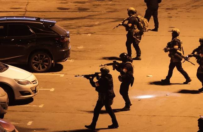 March 22, 2024. Russia, Moscow Region, Krasnogorsk. Special police unit officers are seen outside the Crocus City Hall in the town of Krasnogorsk after a mass shooting by several unidentified gunmen. Evacuation is underway. DmitryxGolubovich