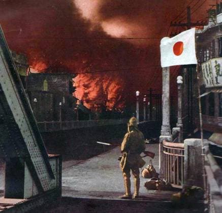 China: Second Sino-Japanese War (1937-1945). Shanghai suburbs ablaze as a Japanese soldier looks on. The Second Sino-Japanese War (July 7, 1937 September 9, 1945) was a military conflict fought primarily between the Republic of China and the Empire of Japan. After the Japanese attack on Pearl Harbor, the war merged into the greater conflict of World War II as a major front of what is broadly known as the Pacific War. Although the two countries had fought intermittently since 1931, total war started in earnest in 1937 and ended only with the surrender of Japan in 1945.<br ><br > The war was the result of a decades-long Japanese imperialist policy aiming to dominate China politically and militarily and to secure its vast raw material res Copyright: xxPicturesxFromxHistoryx