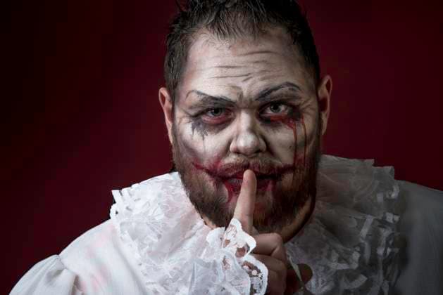 Scary Evil Clown Portrait of a Scary Evil Clown. Studio shot with horrible face art ,model released, Symbolfoto Copyright: xZoonar.com Multipediax 13166642 ,model released, Symbolfoto ,property released