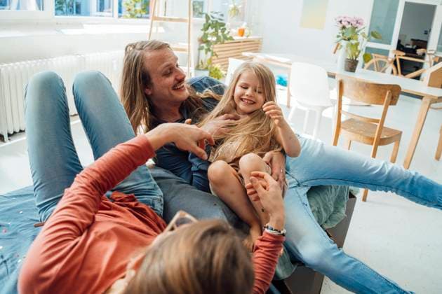 Cheerful father and mother having fun with daughter at home model released, Symbolfoto property released, JOSEF23761