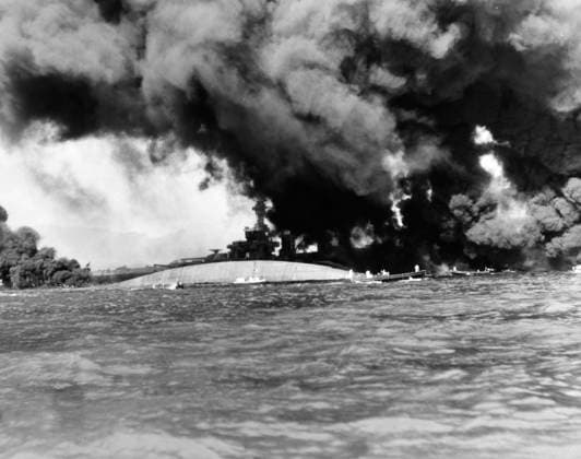 WORLD WAR II: PEARL HARBOR. The capsized USS Oklahoma and the USS Maryland during the Japanese attack on the U.S. naval base at Pearl Harbor, Hawaii, 7 December 1941.  Copyright: xGRANGERx xGRANGERx 0100310